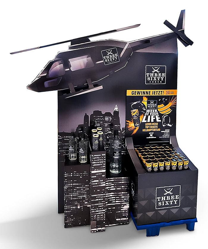 An image of a custom paper-based display solution featuring a helicopter-shaped design at the top.