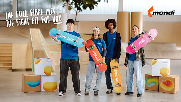 Four young people are holding colourful skateboards, each adorned with the names of Containerboard's various product categories. They are surrounded by Mondi boxes, and in the top left corner, the phrase 