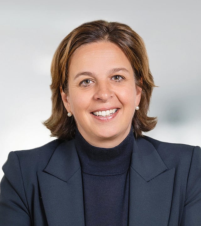 image of Marita Erler wearing a black rollneck jumper and blazer