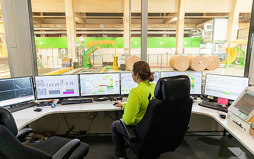 female production worker with monitors