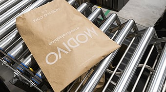 Mondi paper packaging sitting on top of a conveyor belt