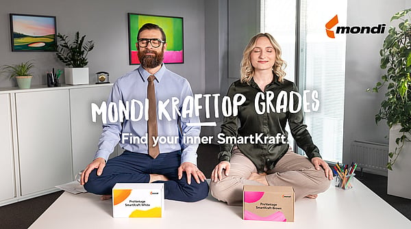 two people meditating with cardboard boxes