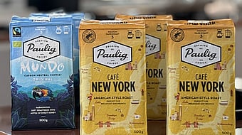 six packages of Paulig packaging lined up in two rows of three, some are blue, some are yellow
