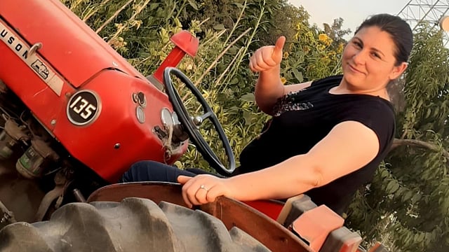 Kadriye Bilgin on a tractor