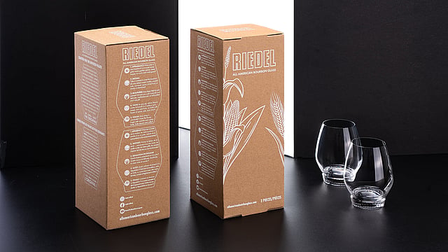 two corrugated boxes and two drinking glasses on a table