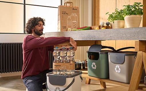 A man recycling a hug&hold clip.